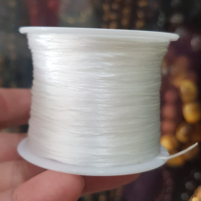 Cuộn Dây Thun CO GIÃN màu Trắng xỏ vòng hạt chuỗi Dây này là dây thun chuyên xỏ vòng chuỗi màu Trắng, có đủ màu Anh Chị đang đeo chuỗi muốn thay dây khác cho vòng thì đặt cuộn Thun chỉ này nhé 